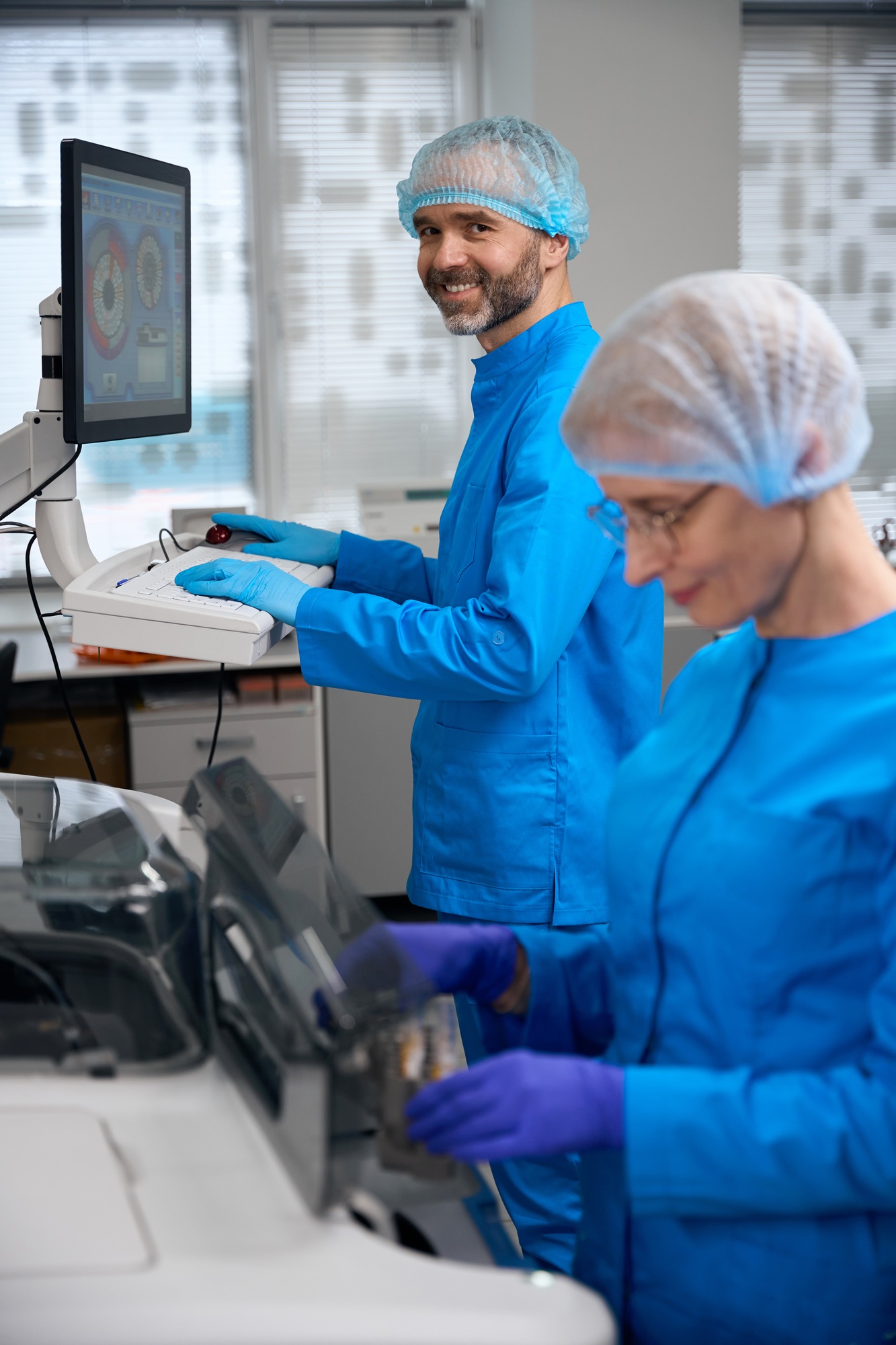 Laboratory assistants use high-tech equipment in their work