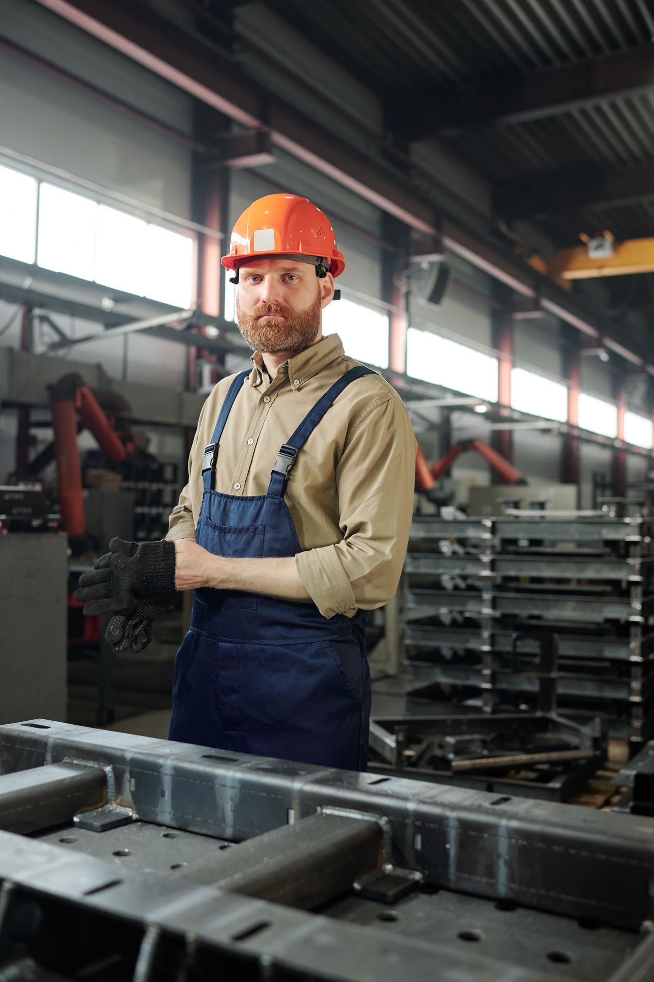 Manufacturing worker putting on gloves